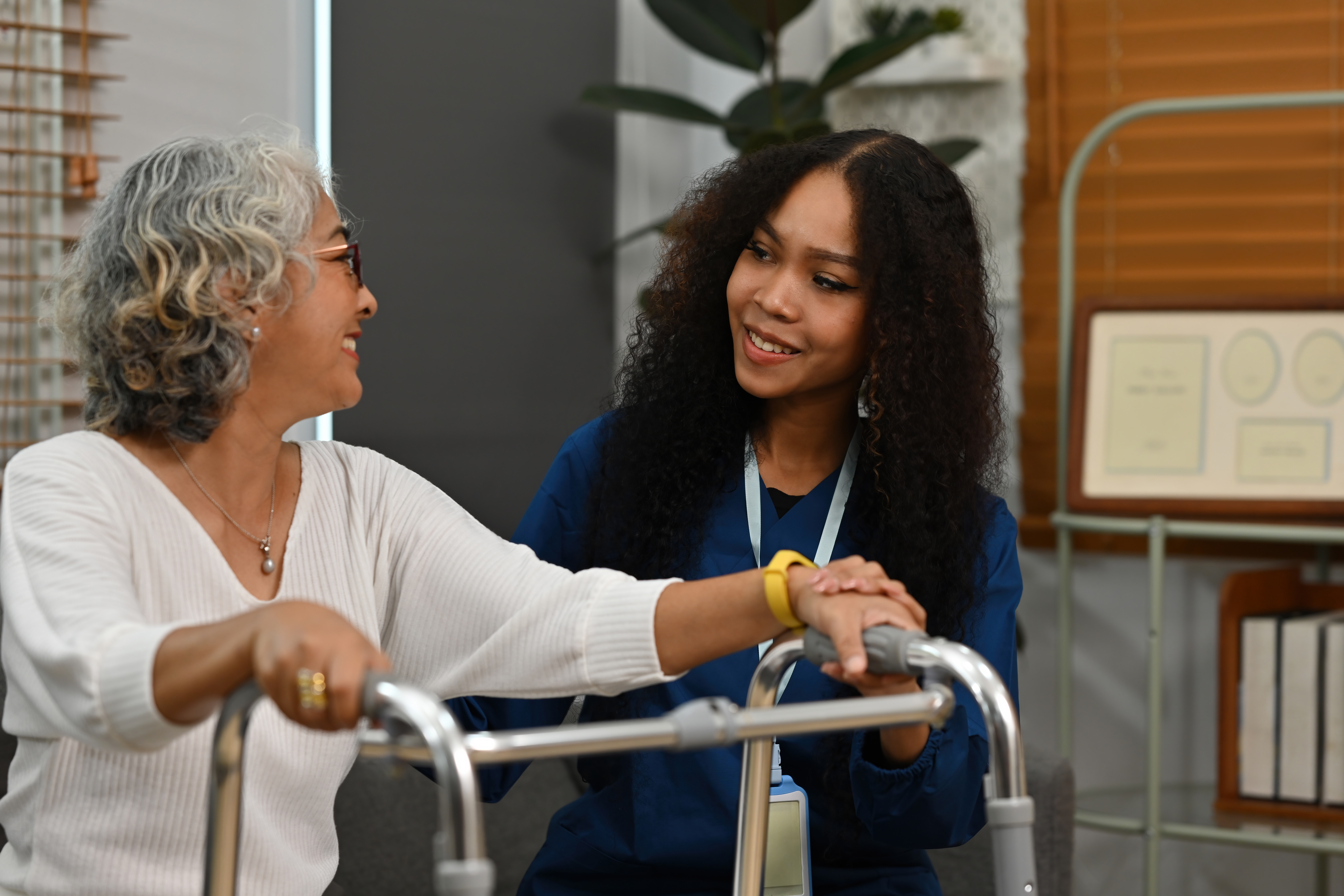 Healthcare worker helping elderly patient